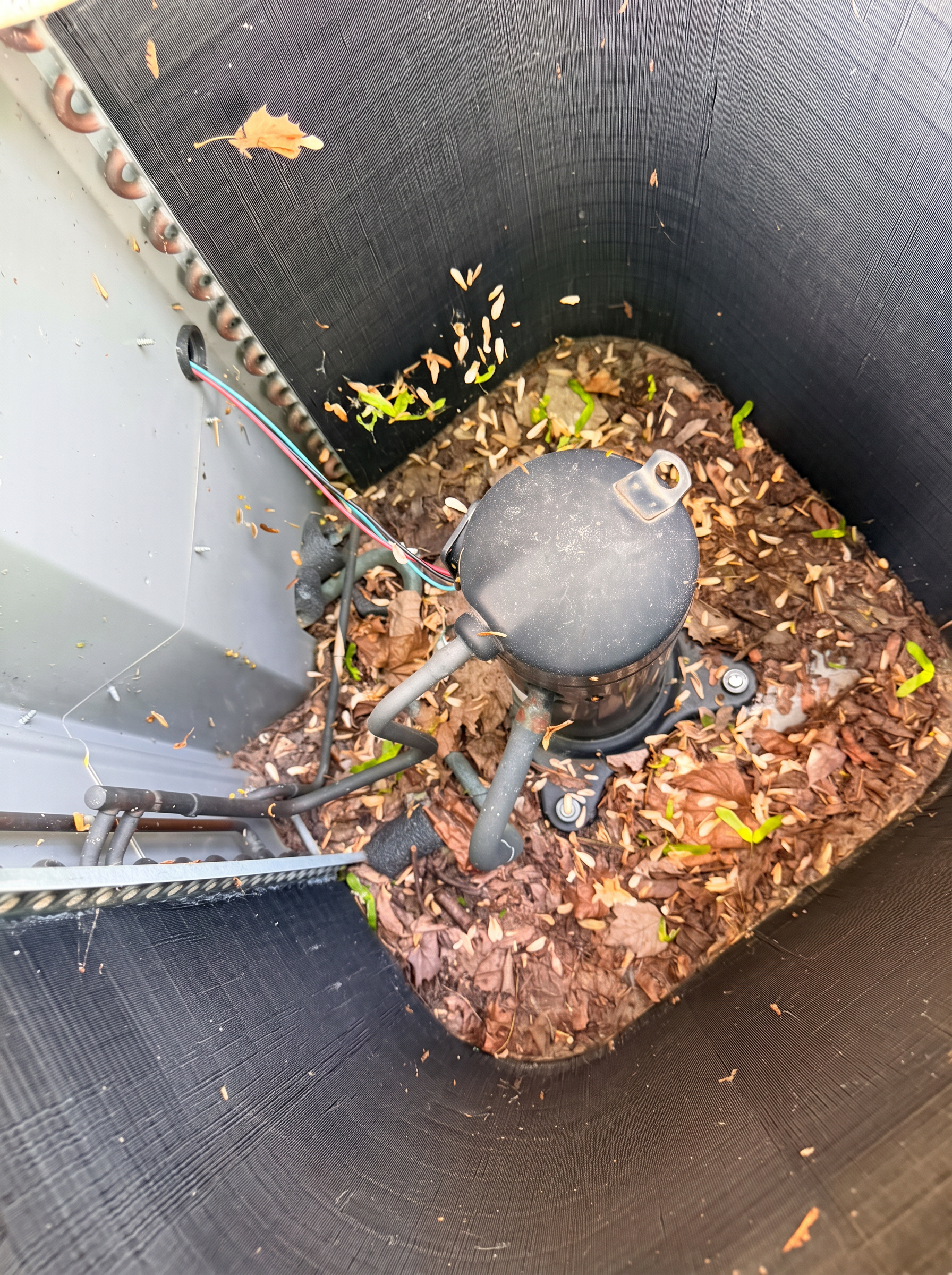 Before — debris packed around the compressor